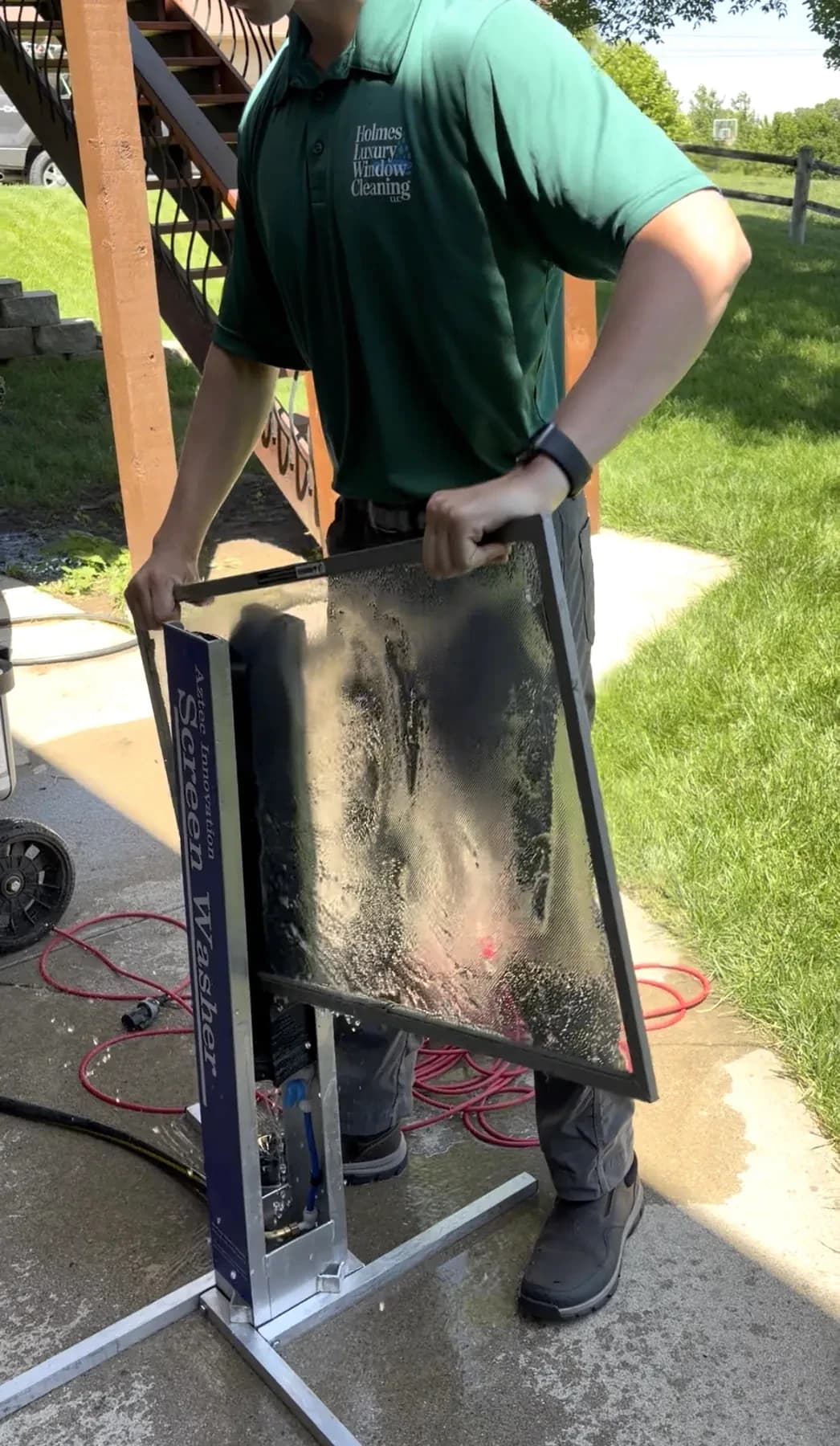 Running a window screen through the screen washer in Omaha, NE