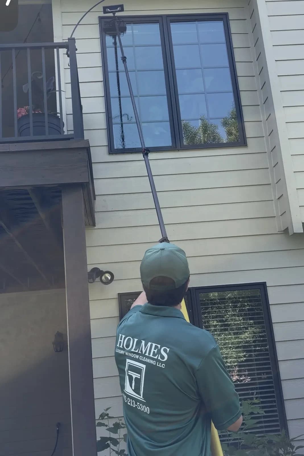 Holmes Luxury Window Cleaning working on an Omaha home